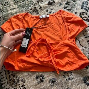 Fashion nova orange cropped top, with tags !
